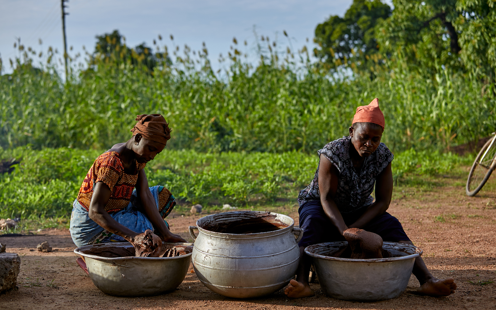 Women in Ghana making shea butter to sell.